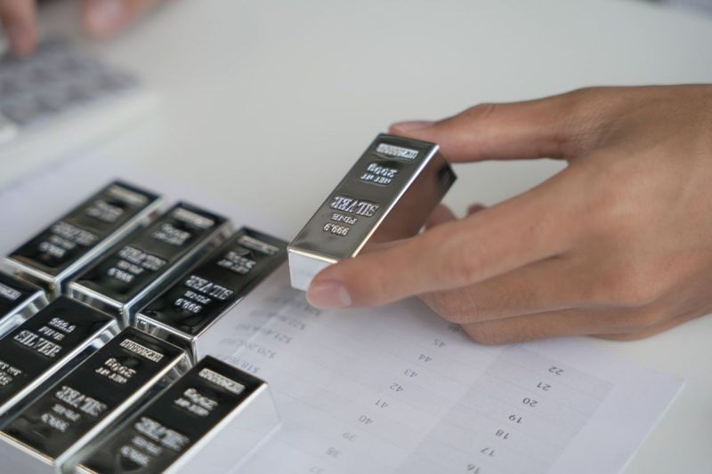 <strong>Investing in silver futures is one of many options for those interested in entering the silver market.</strong>
The highest price for silver to date was reached half a century ago, when the precious metal hit US$48.70 per ounce. With the silver price hitting US$44 per ounce following the US Federal Reserve’s September 2025 rate cut, investors are wondering if the white metal will it break past its record. Some silver bulls believe that could happen in the near future, with a few market insiders even calling for a triple-digit silver price.
Trading silver futures is not the same as owning physical bullion, but it’s a popular strategy for advanced investors with a higher risk tolerance. Read on to learn more about how silver futures work and what role they can play in a portfolio.
                            What are silver futures?                                
Silver futures trading involves an agreement between a buyer and a seller in which physical silver will be bought by the buyer and delivered by the seller for a fixed price at a date set in the future.
Most traders (especially short-term traders) aren’t concerned about delivery when it comes to silver futures — they typically use cash to settle their long or short positions before they expire or defer them to the next available delivery month. Overall, very few silver futures contracts traded each year actually result in the delivery of the underlying commodity.
                            What exchanges are silver futures traded on?                                
Silver futures can be traded on various global exchanges, but the COMEX is a common option. The COMEX is one of four exchanges that make up CME Group, which bills itself as the world’s leading derivatives marketplace. 
On the COMEX, monthly silver futures contracts are listed for the current calendar month or the following two calendar months, plus any January, March, May or September within a 23 month period. July and December are also included should they fall within a 60 month period, beginning with the current month. The material offered must assay to a minimum of 999 fineness.
According to Investopedia, silver futures on the COMEX are quoted in US dollars per troy ounce and are traded in units of various sizes, ranging from 1,000 (known as micro contracts) to 2,500 (E-mini contracts) to 5,000 (full contracts) troy ounces. For example, a price quote of US$24 for 5,000 troy ounces would cost approximately US$120,000.
In the case of a full contract, investors who wait for their silver futures to mature will either receive or deliver a 5,000 troy ounce COMEX silver warrant for a full-sized silver future, depending on if they are the buyer or the seller. One warrant entitles the holder to ownership of equivalent bars of silver in designated depositories, such as with the The Brink’s Co  (NYSE:BCO), HSBC Holdings (NYSE:HSBC, LSE:HSBA), Manfra Tordella & Brookes, Delaware Depository and JPMorgan Chase & Co. (NYSE:JPM).
The COMEX settlement process is different for smaller silver futures contracts.
Silver futures are also traded electronically on the Indian National Commodity & Derivatives Exchange (NCDEX), the Dubai Gold & Commodities Exchange (DGCX), the Multi Commodity Exchange of India (MCX) and the Tokyo Commodity Exchange (TOCOM).
                            Why invest in silver futures?                                
Silver typically follows in the footsteps of gold and is considered a safe-haven asset. Investors tend to flock to precious metals in times of turmoil, which bumps up demand, and if gold is too expensive, silver is a cheaper option.
Futures offer a limit on potential losses to buyers, which attracts those interested in hedging. Hedgers such as producers, portfolio managers and consumers often use futures to mitigate price risk — their goal is to protect themselves from inflation and to reap the rewards of favorable price movements. On the flip side, speculative investors can use silver futures to gain exposure to the white metal while only putting up a fraction of the total cost for a contract.
Of course, silver has equal potential to suffer large losses in the futures market — due to the leverage involved, investors can lose funds in their accounts quickly. For that reason, experts often encourage inexperienced market participants to avoid the futures market until they have a good idea of their desired risk profile, time horizon and cost considerations.
<strong>Securities Disclosure: I, Melissa Pistilli, hold no direct investment interest in any company mentioned in this article.</strong>
This post appeared first on investingnews.com